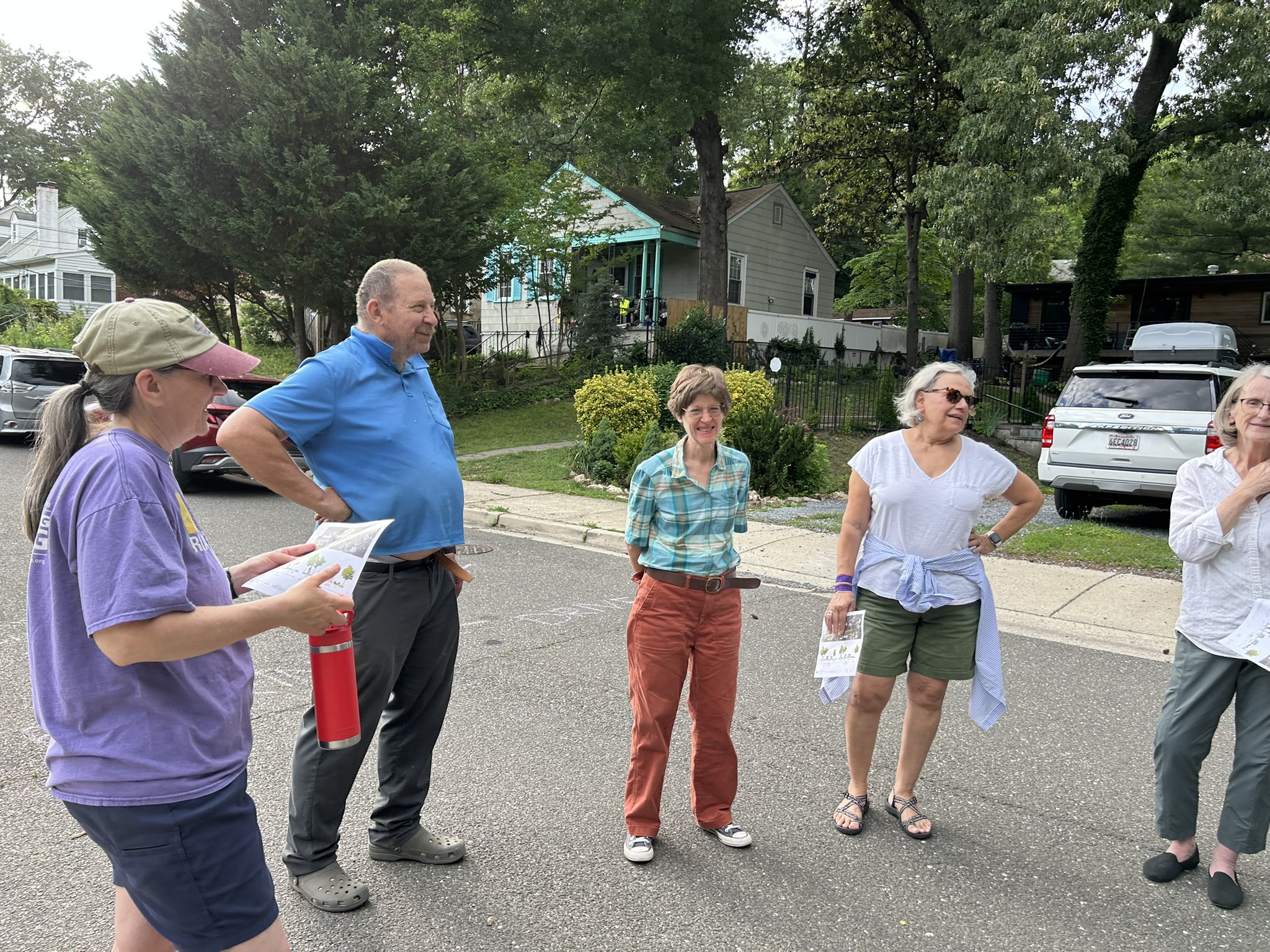 Residents meet in the middle of Kennedy Street at the May 28 Community Meeting