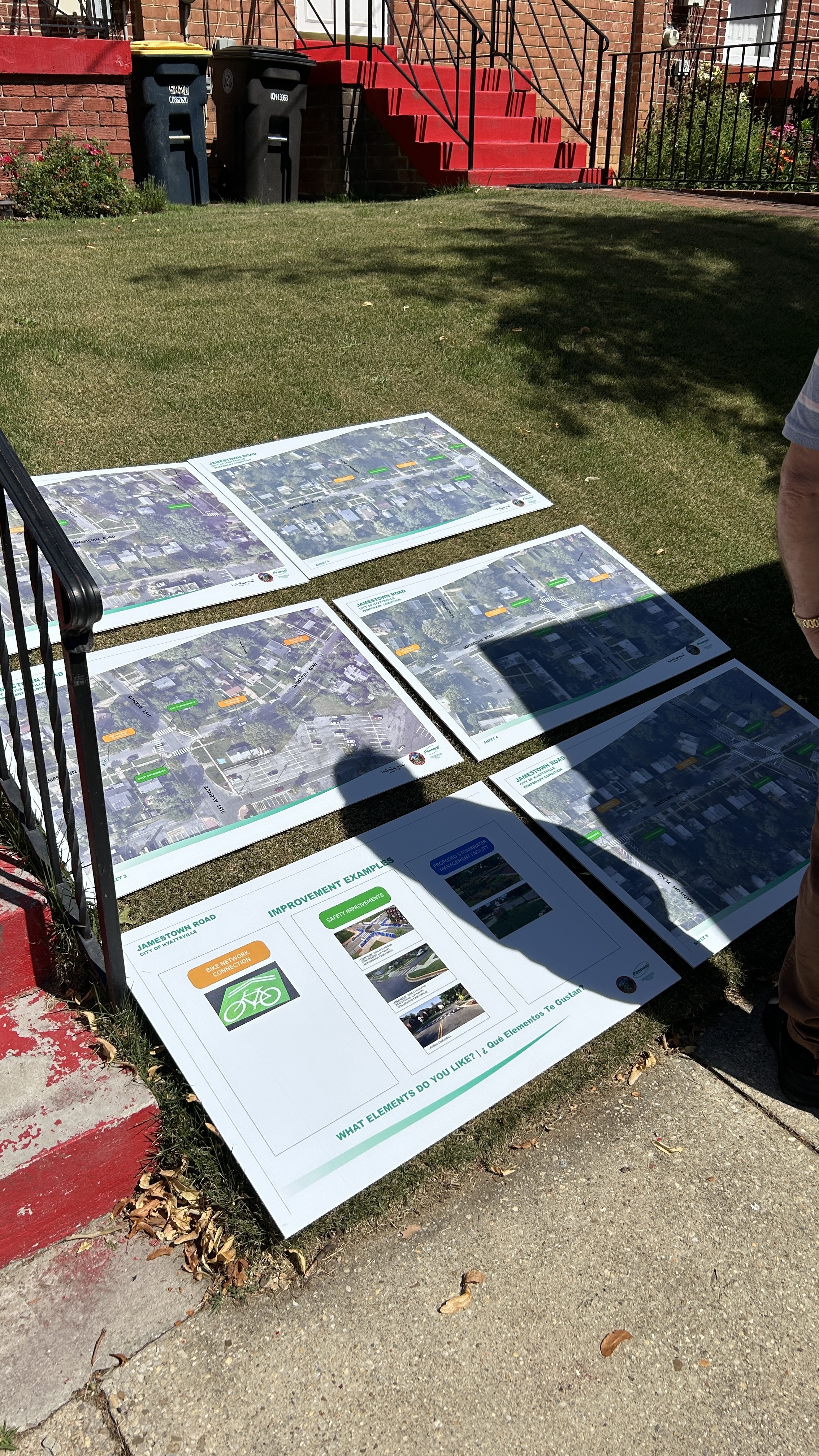 Poster boards show proposed traffic calming and stormwater interventions along Jamestown Road.